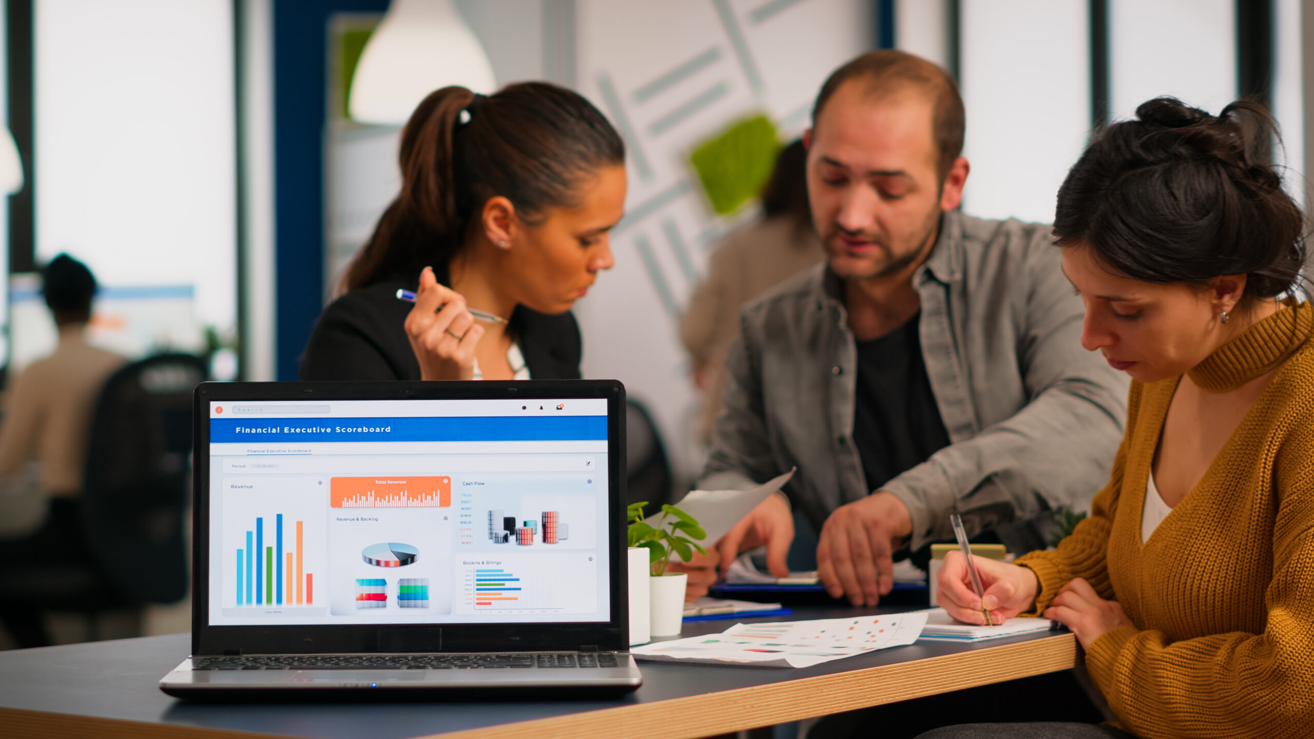 Business woman talking about financial project using laptop